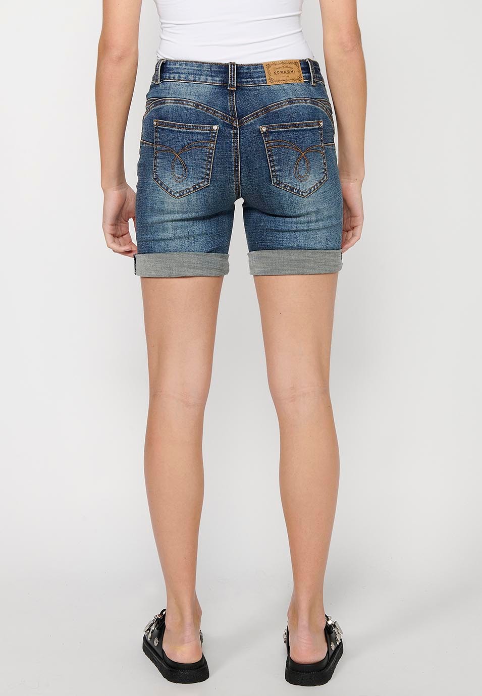 Short shorts with a turn-up finish with front zipper and button closure and blue floral embroidery for Women 5