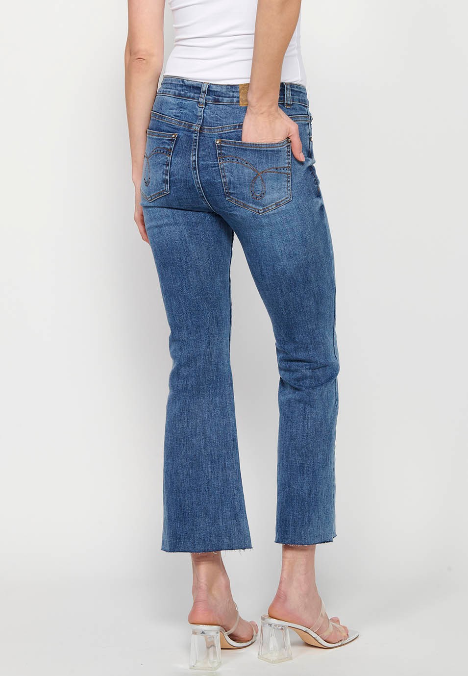 Long flared denim pants with front closure with zipper and button and five pockets, one pocket in Dark Blue for Women 7