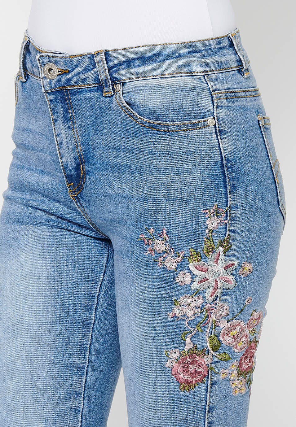 Slim long pants with front zipper and button closure with embroidered details in Blue for Women 6
