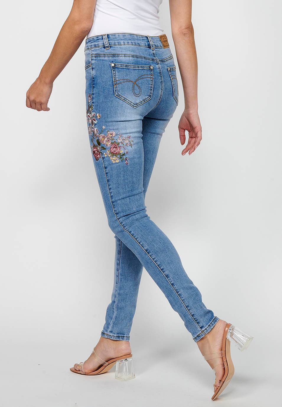Slim long pants with front zipper and button closure with embroidered details in Blue for Women 5