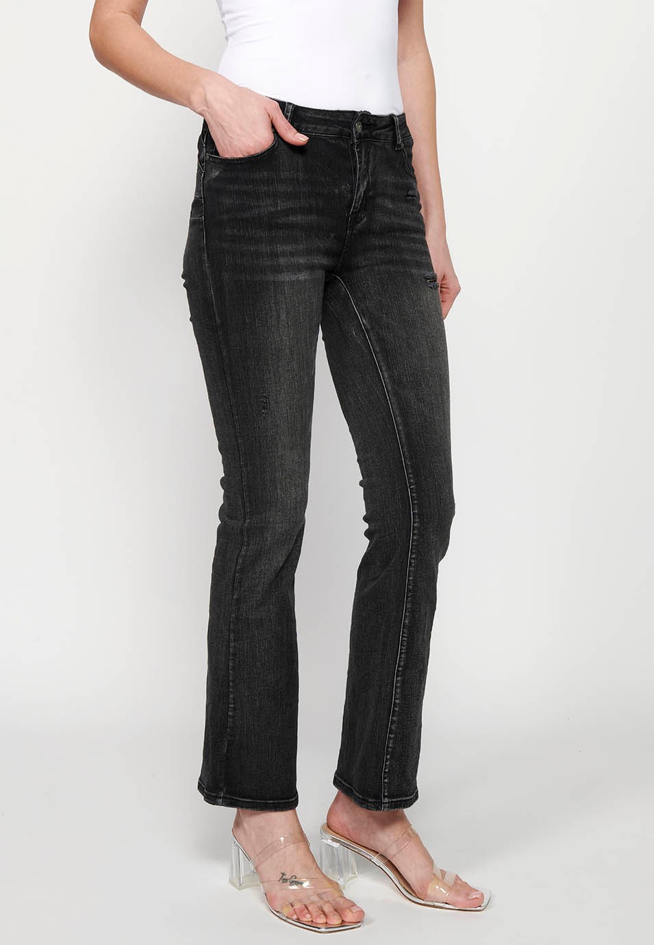 Pantalon long à cloche avec détails cassés en noir pour femme