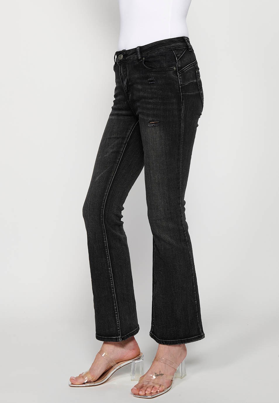 Pantalon long à cloche avec détails cassés en noir pour femme