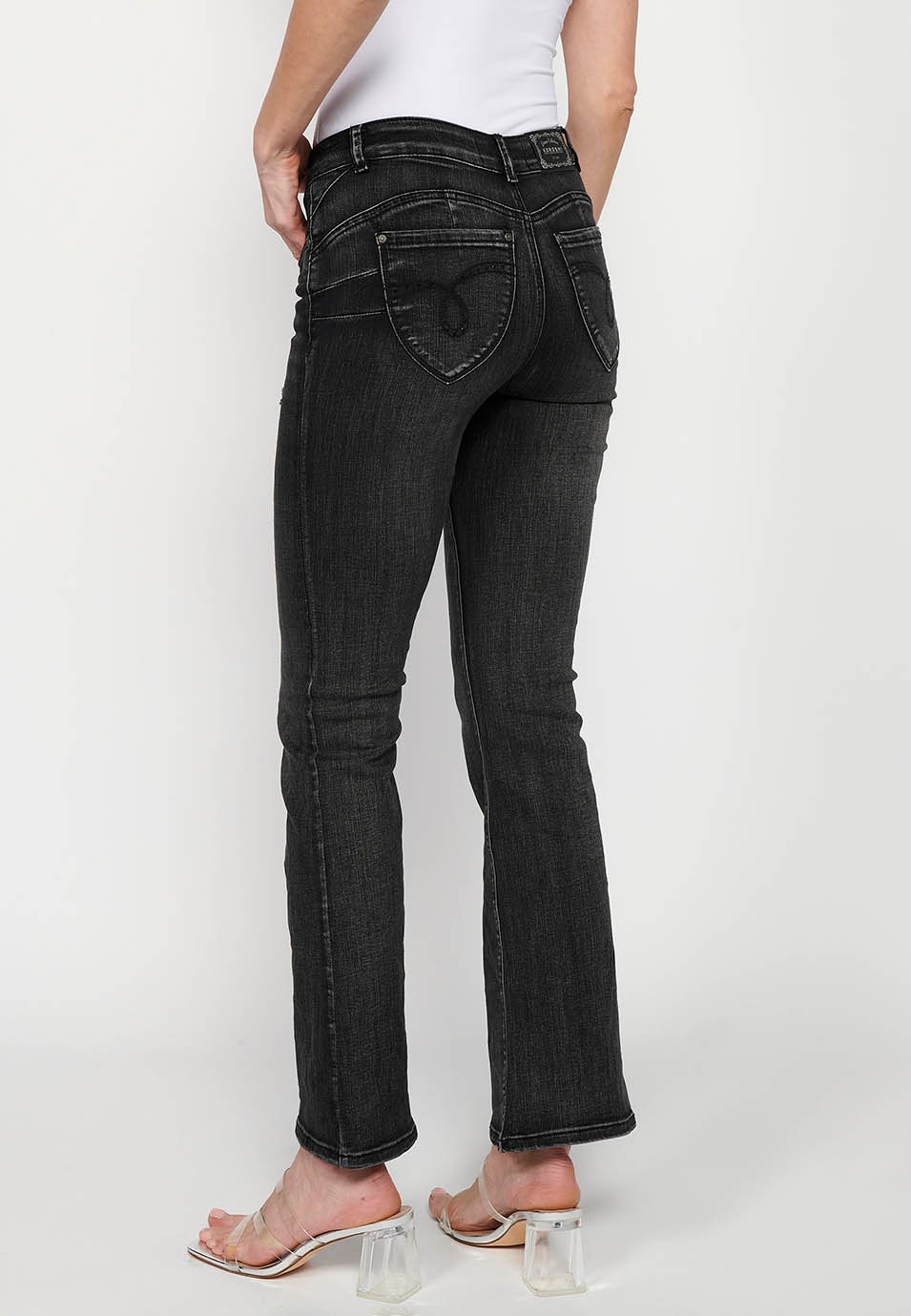 Pantalon long à cloche avec détails cassés en noir pour femme