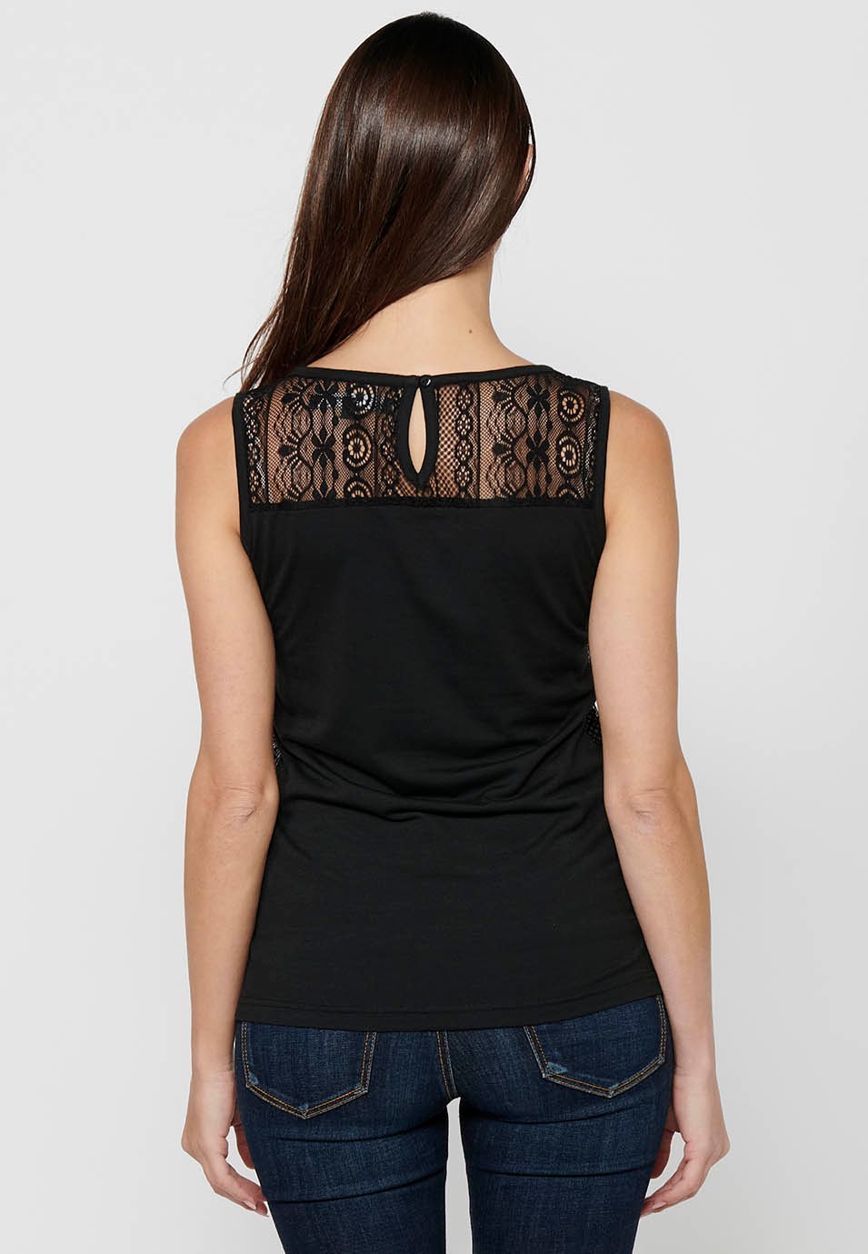 T-shirt sans manches avec broderie noire sur le devant pour femme