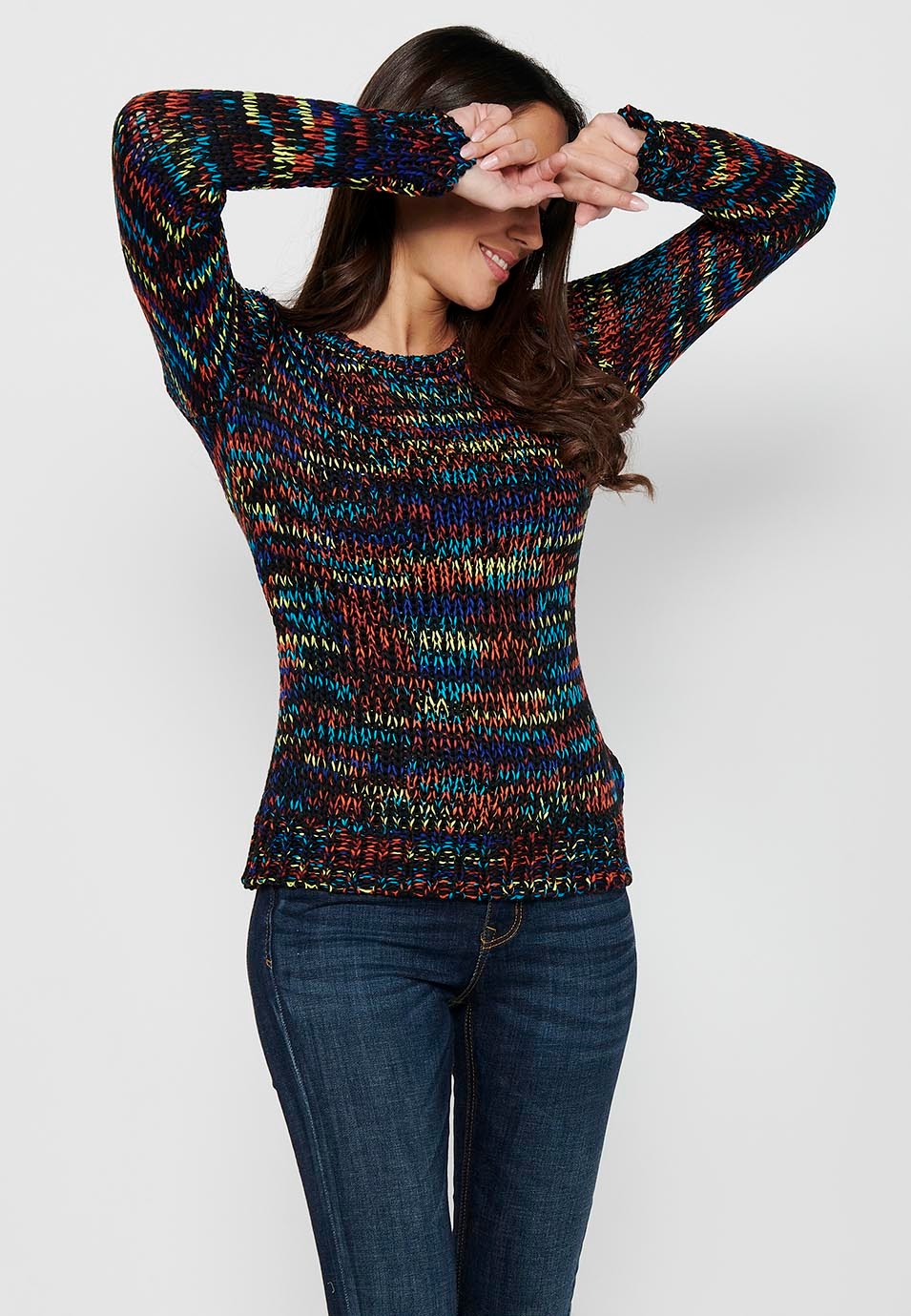 Pull col rond manches longues. Tricot rayé multicolore pour femme