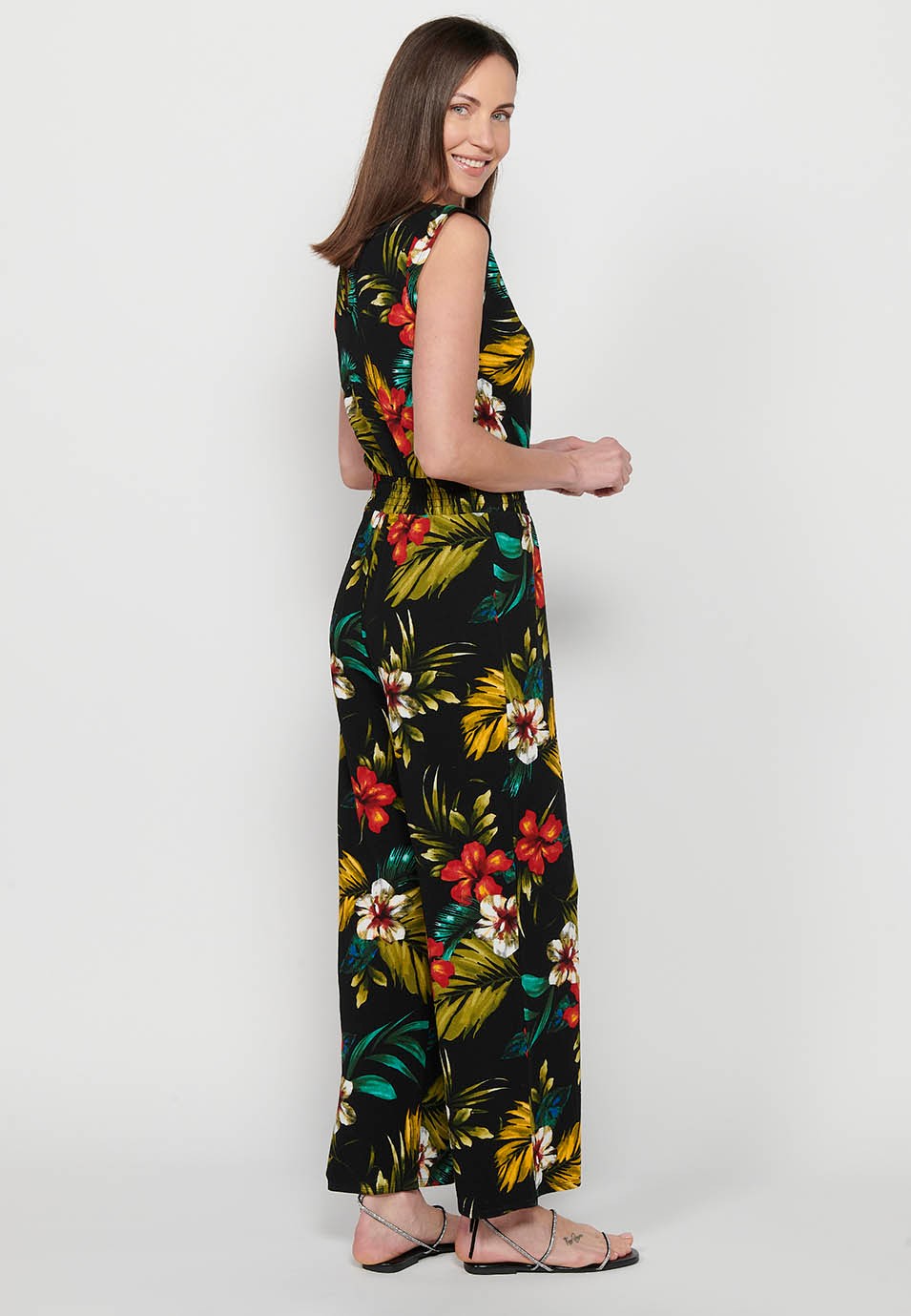 Jumpsuit dress with zipper back closure and tropical floral print, round neck and tight waist with elastic band in Multicolor for Women