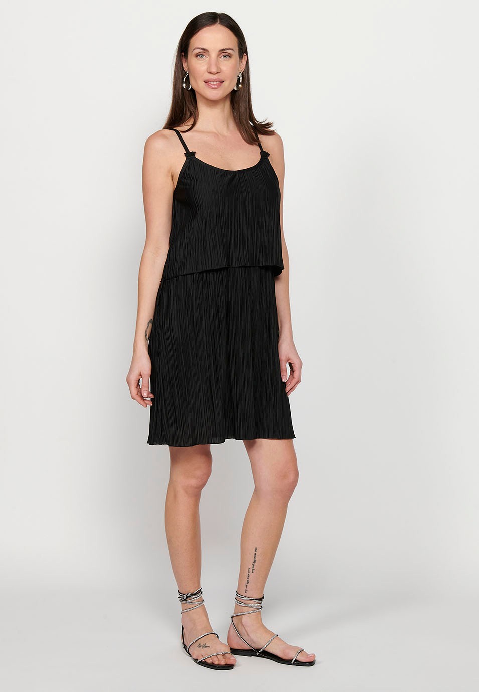 Short strap dress with pleated fabric and rubberized waist cut in a black layer for Women