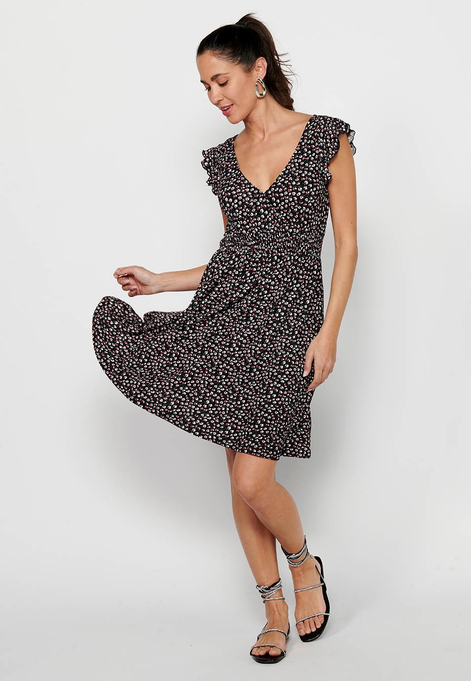 Short-sleeved dress with crossed V-neckline and floral print with fitted rubberized waist in Black for Women