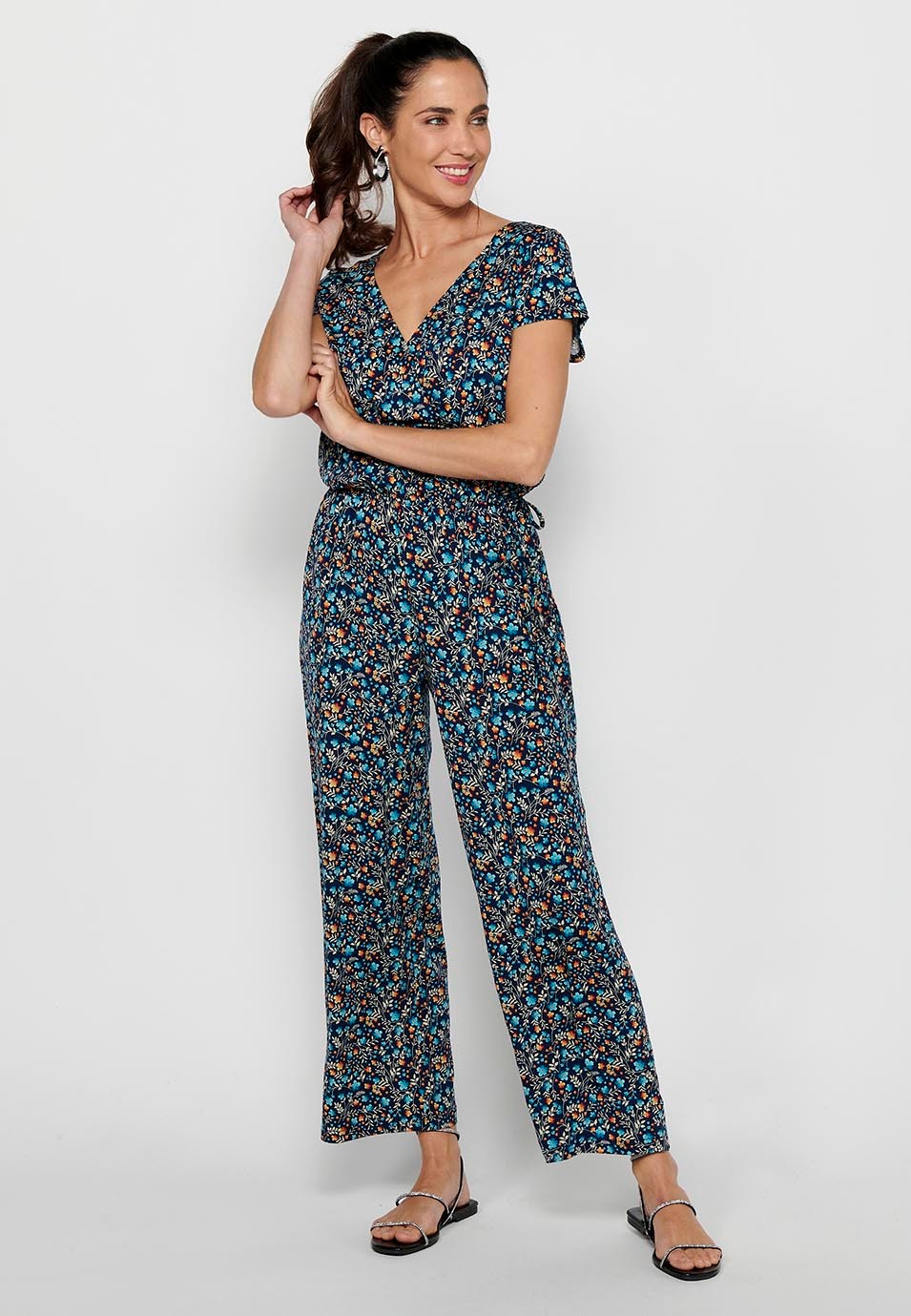 Short-sleeved jumpsuit with crossed V-neckline and tight waist with elastic band in Multicolor for Women