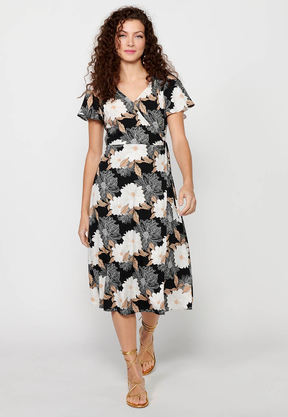 Short-sleeved dress with crossed V-neck and floral print in Black for Women