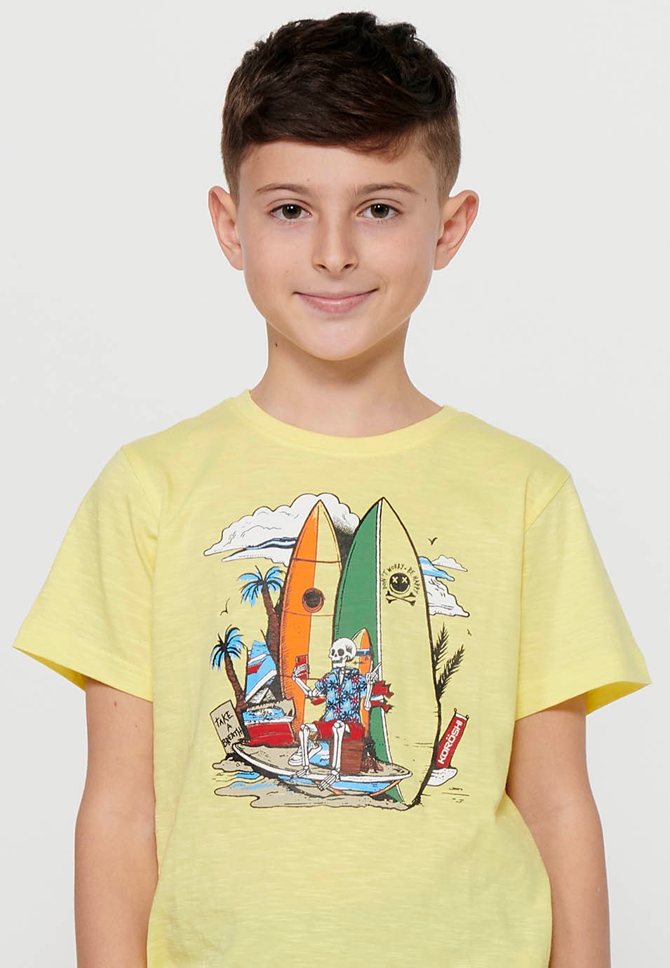 Short-sleeved cotton T-shirt with a round neckline. Yellow front print for Boys