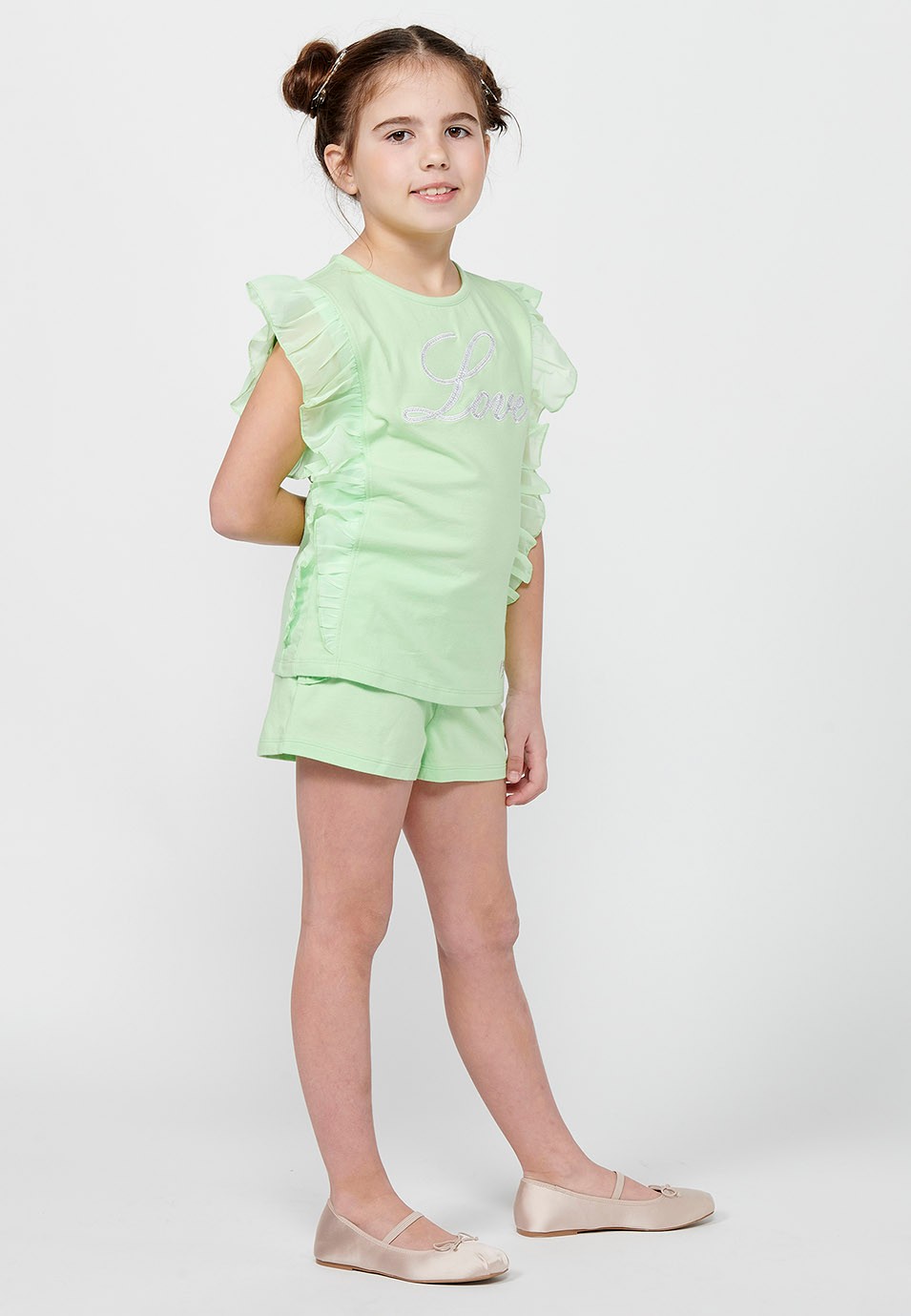 Pack haut et short. T-shirt sans manches à volants avec broderie sur le devant et Short avec finition volants de couleur Lime pour Fille