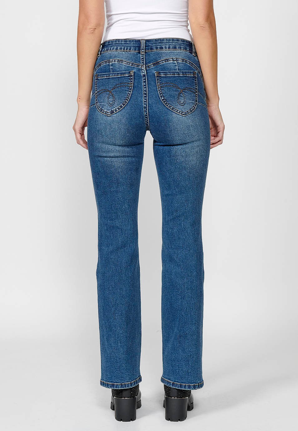Women's blue flared boot cut denim trousers with five pockets and embroidered flowers on the hip