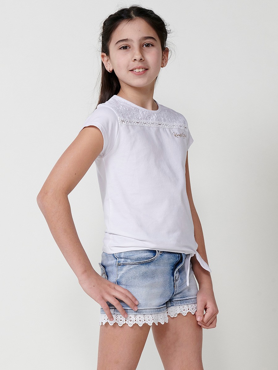 Girls' white top with waist tie, mesh yoke, and gold Koröshi logo