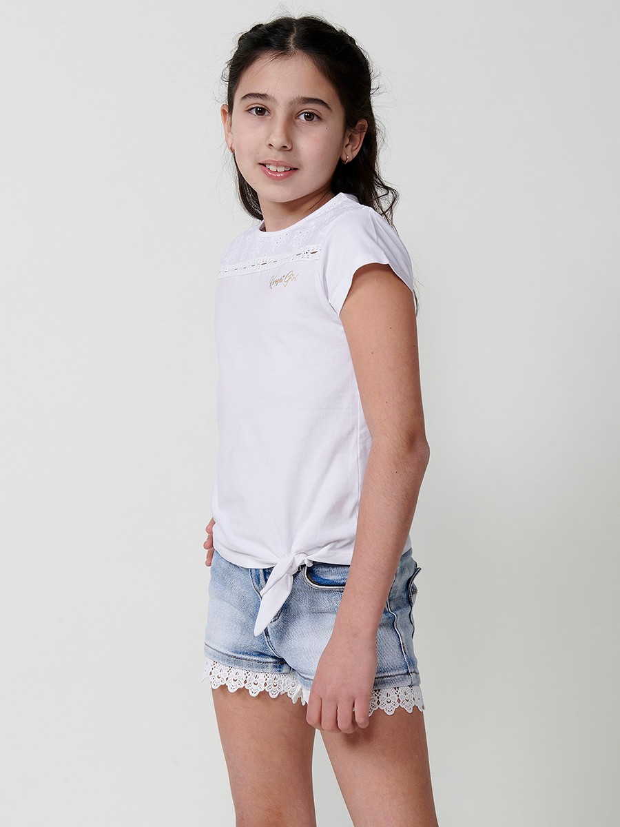 Girls' white top with waist tie, mesh yoke, and gold Koröshi logo