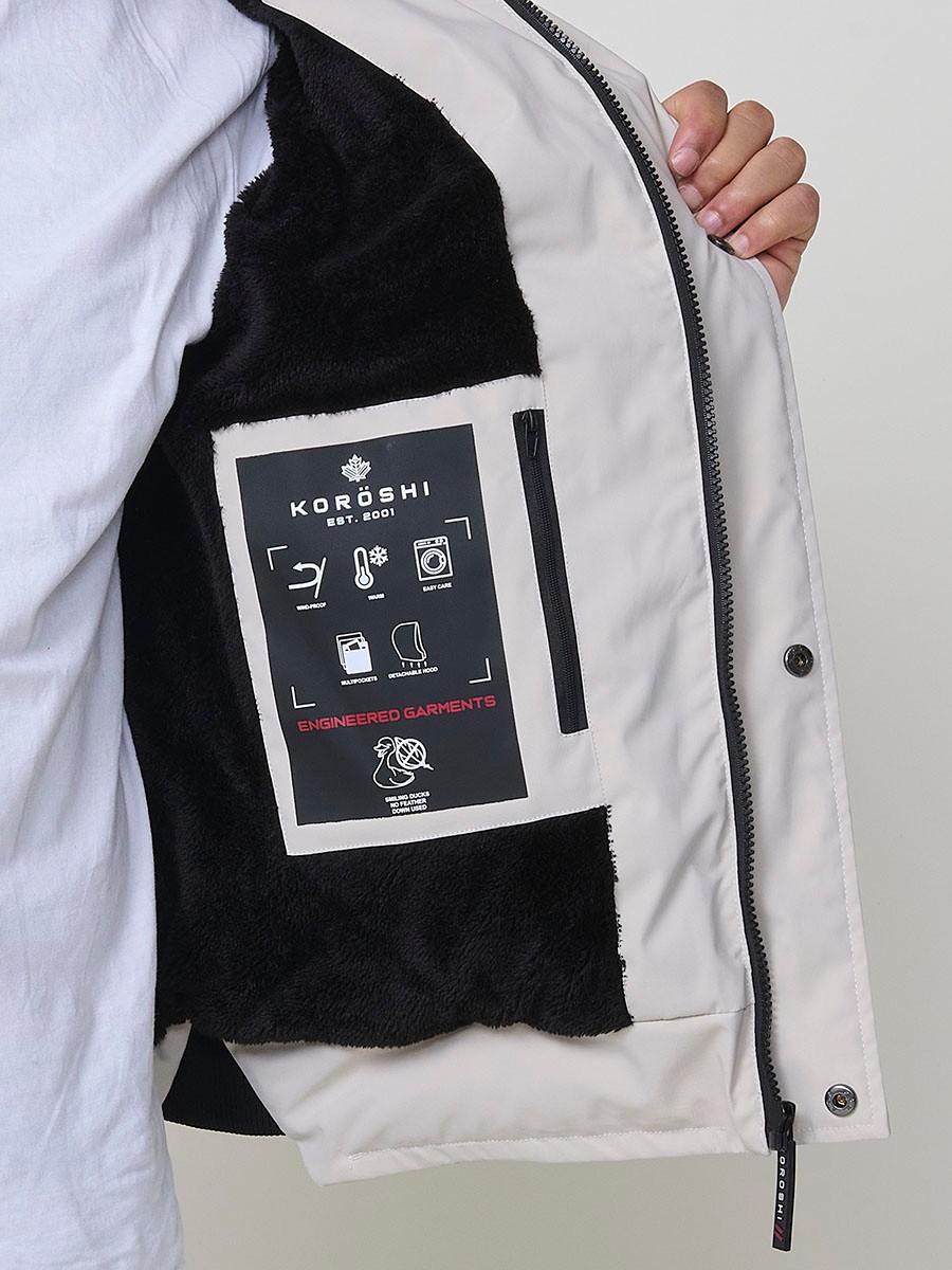 Gesteppte steinfarbene Herrenjacke mit hohem Kragen, Kapuze, Reißverschluss und Taschen. Aus 100 % Polyester, warm, strapazierfähig und leicht.