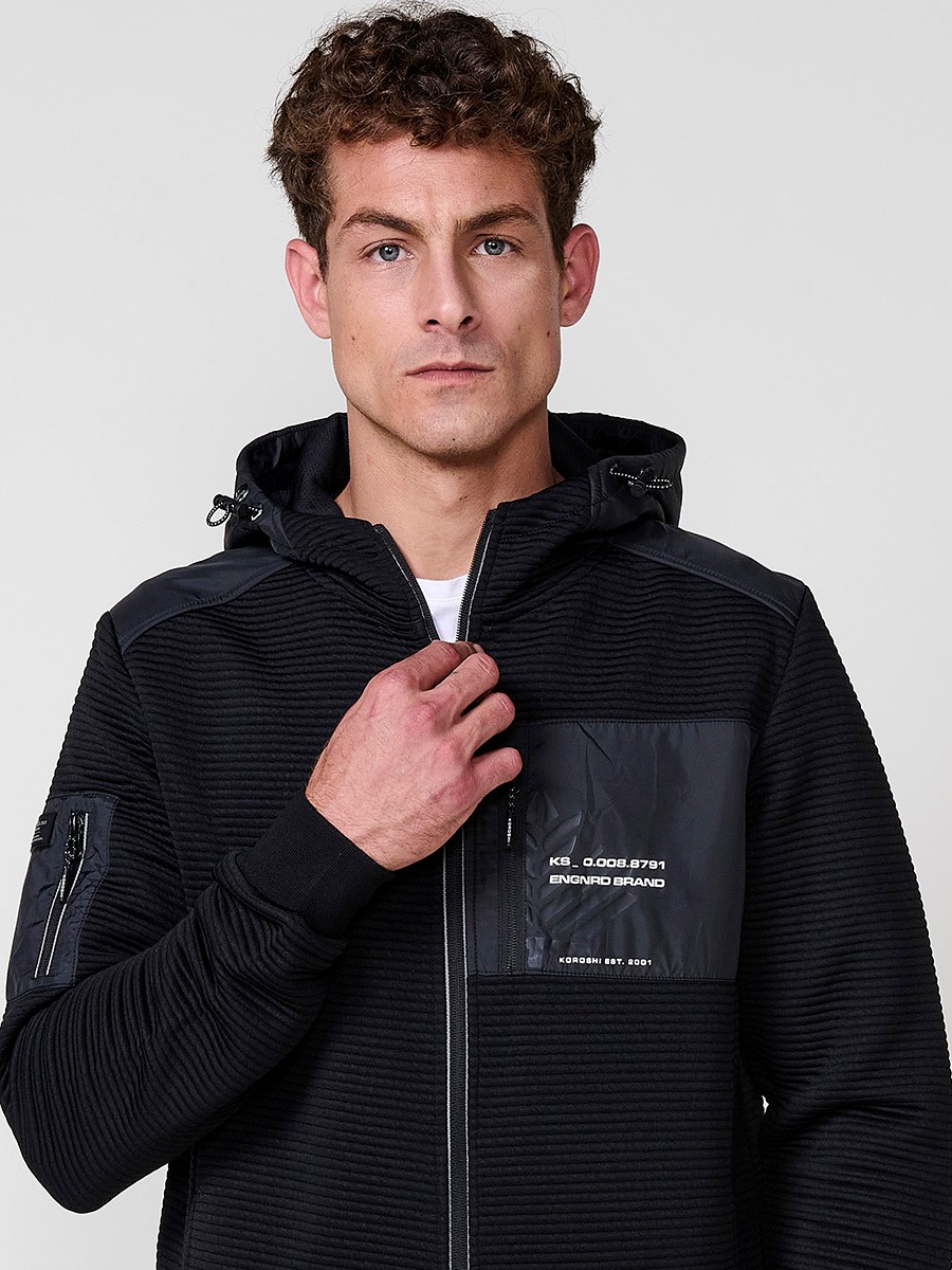 Men’s black hoodie jacket with high neck, hood and zip closure. Made of 100% polyester, comfortable, lightweight and versatile.