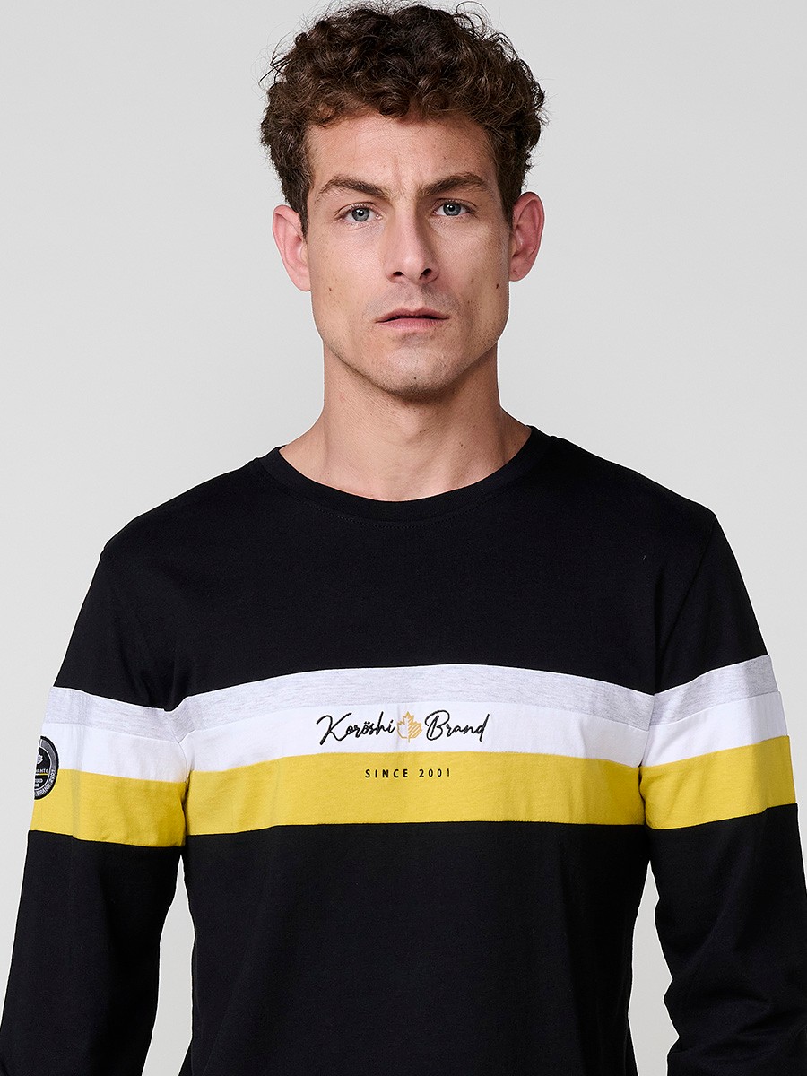 Camiseta de hombre negra de manga larga, 100% algodón, con cuello redondo y estampado delantero.