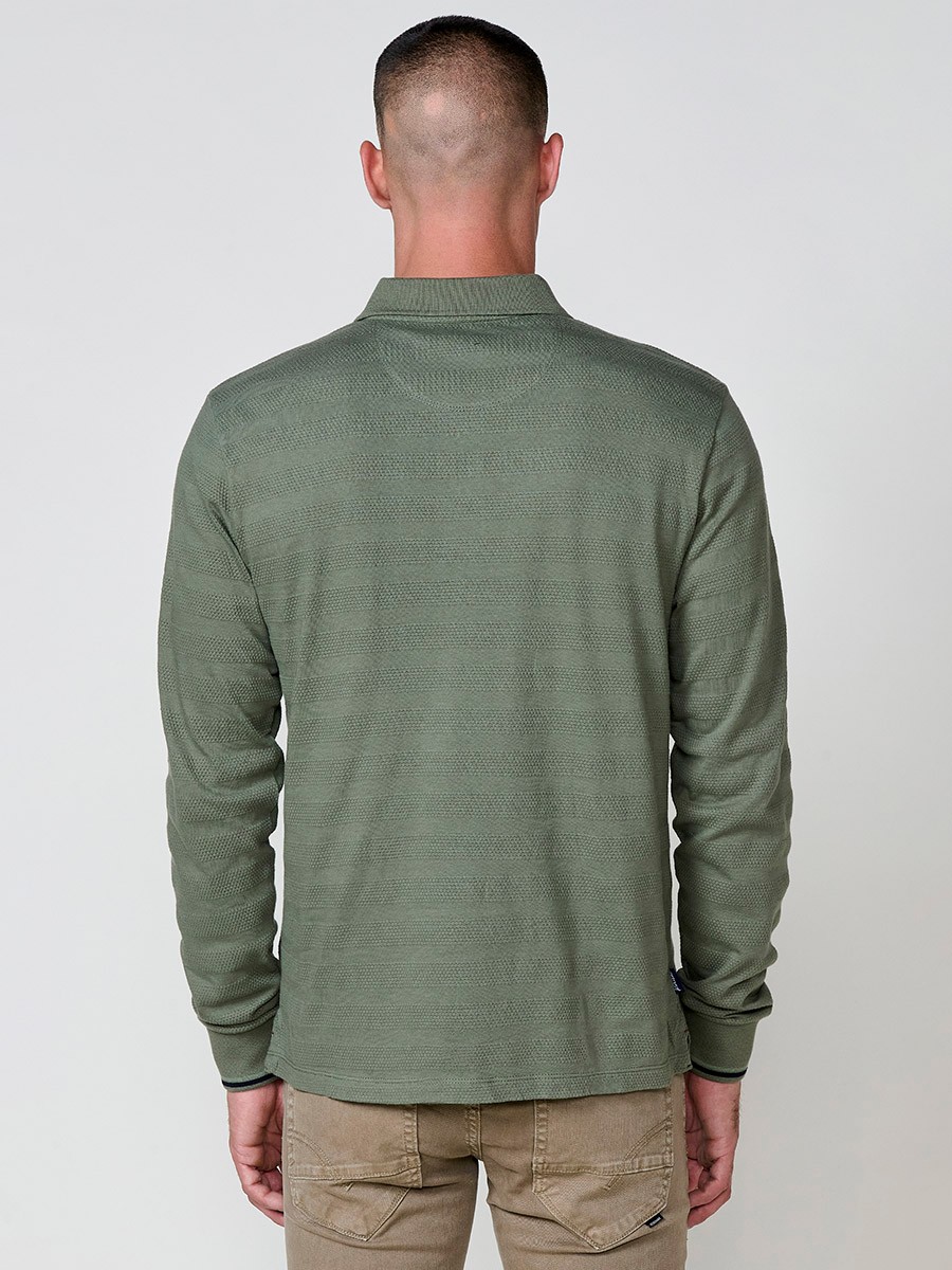 Polo de hombre de manga larga con cuello camisero. Prenda masculina básica de algodón 100%.