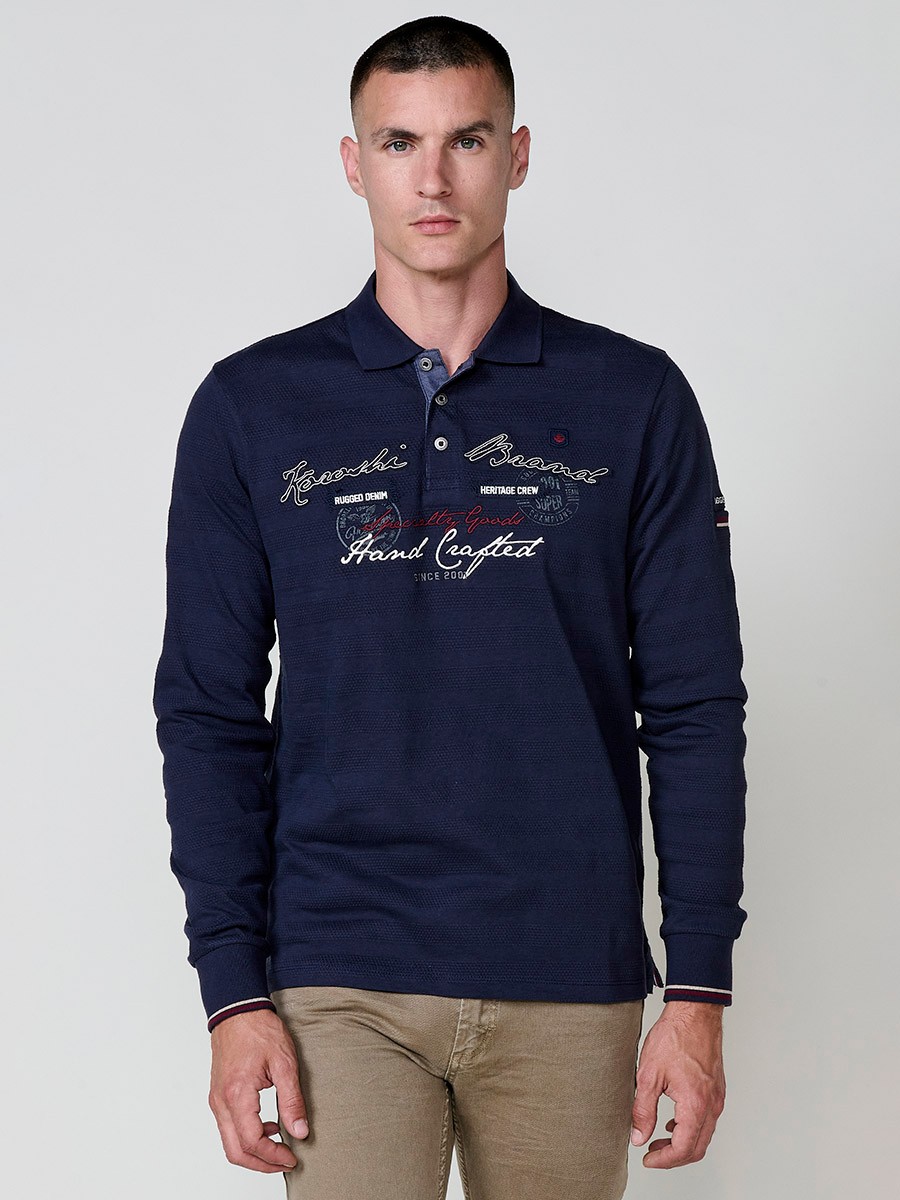 Polo de hombre en color navy, de manga larga y cuello camisero. Prenda masculina básica de algodón 100%.