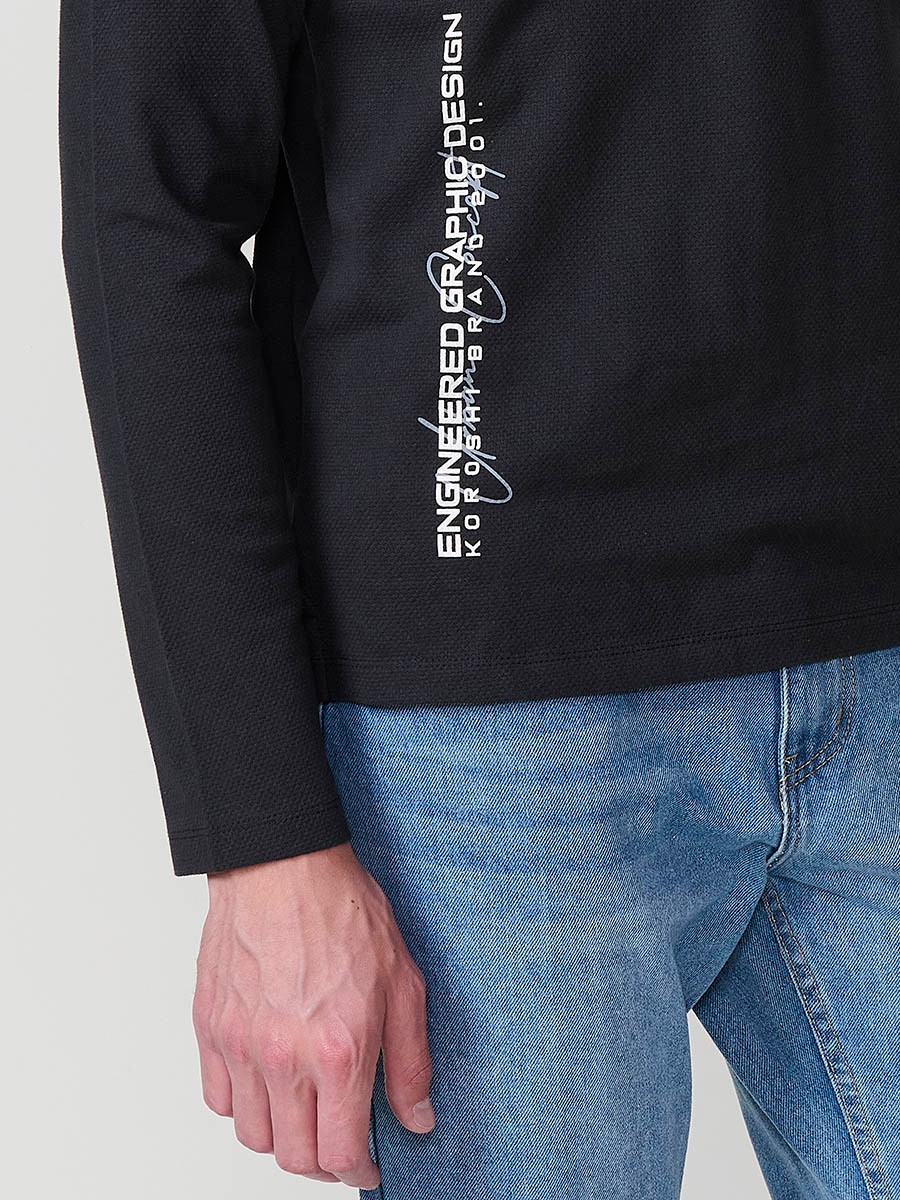 Polo de hombre antracita de manga larga, 100% algodón, con cuello redondo y estilo versátil para looks urbanos y elegantes.