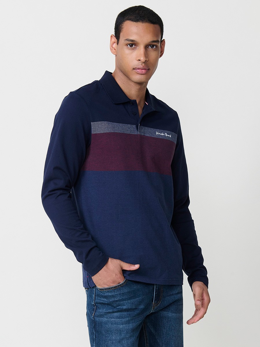 Polo de hombre en color navy de manga larga con cuello camisero. Prenda masculina básica 100% algodón.