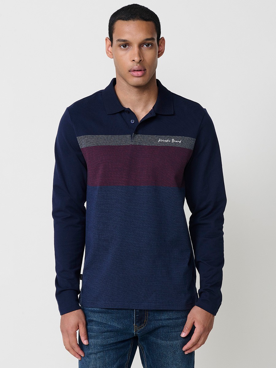 Polo de hombre en color navy de manga larga con cuello camisero. Prenda masculina básica 100% algodón.