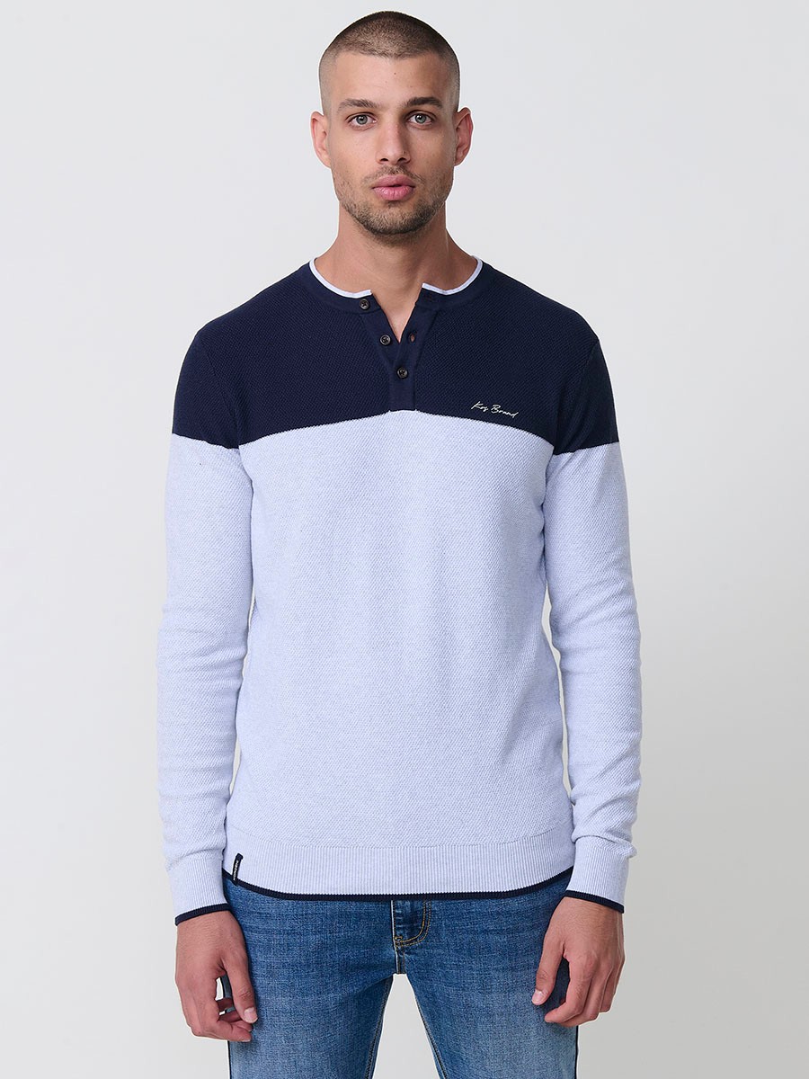 Polo de hombre en punto tricot navy, de manga larga y cuello redondo abotonado. 100% algodón.
