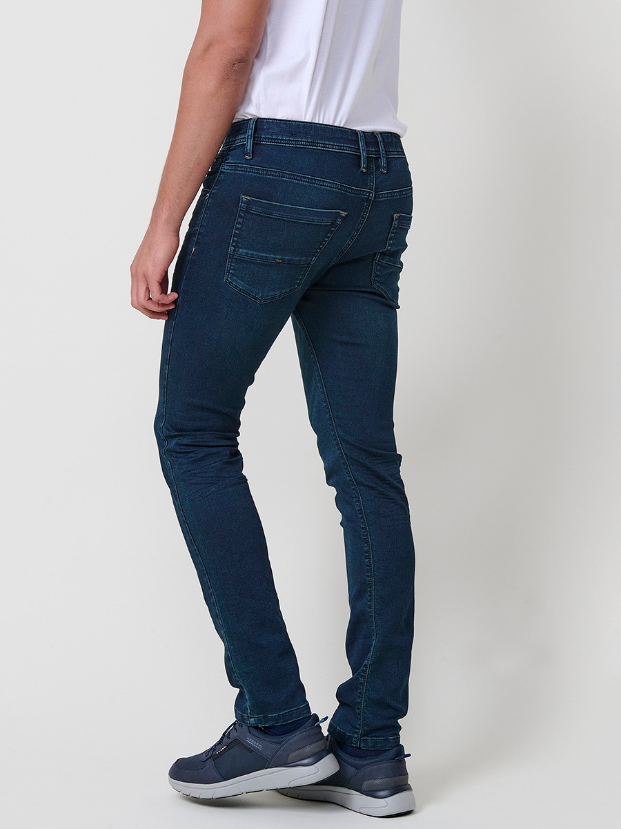 Jean slim fit pour homme avec fermeture éclair et bouton.