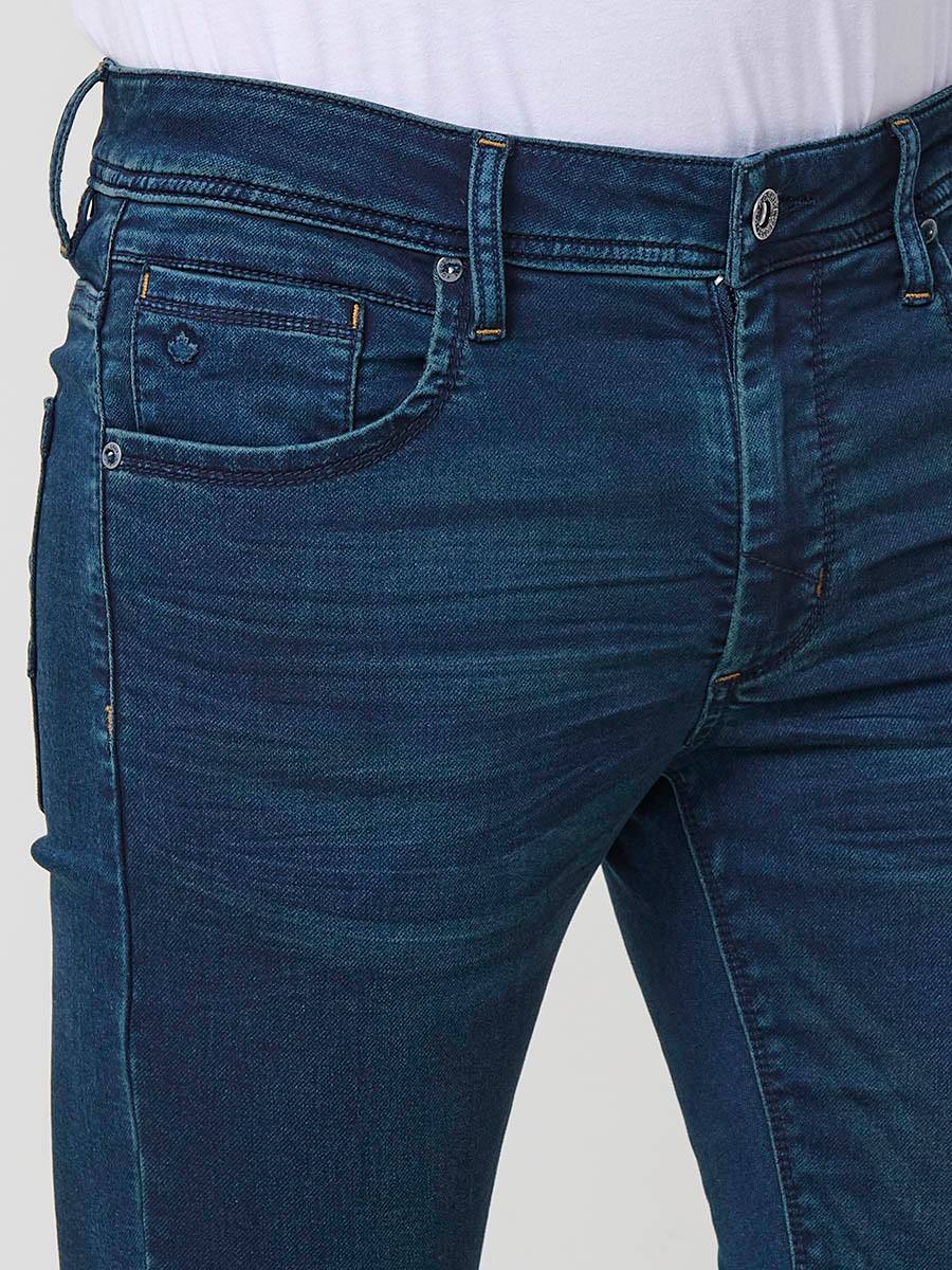 Jean slim fit pour homme avec fermeture éclair et bouton.