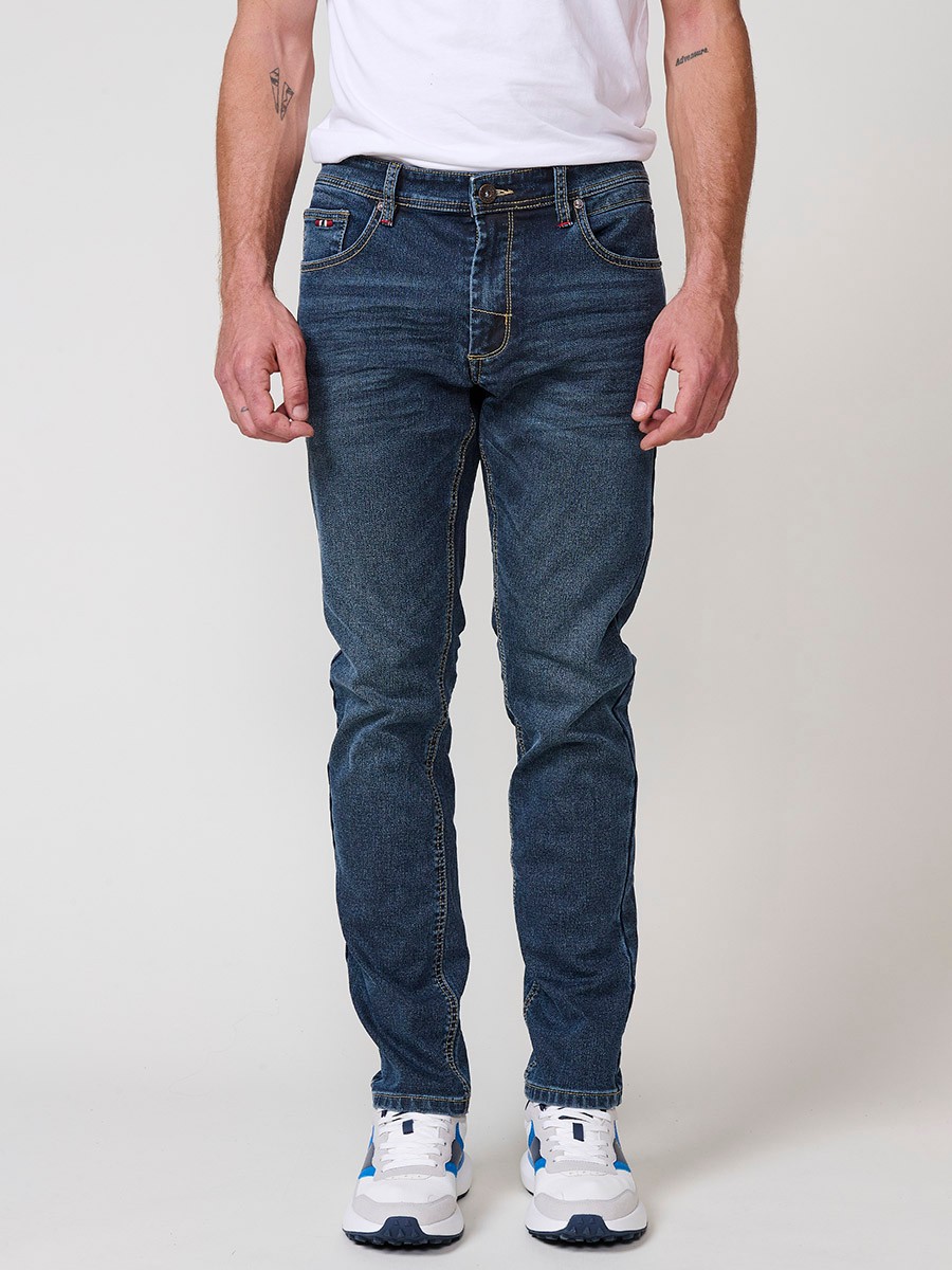 Jeans slim fit de hombre en azul oscuro con cierre de cremallera y botón. Tejido 98% algodón, 2% elastano, cómodo y versátil.