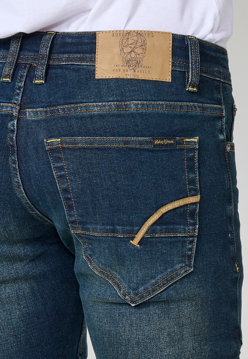 Jean homme Biker Skinny Fit en denim stretch bleu foncé. Coupe ajustée avec détails biker. 98 % coton, 2 % élasthanne.