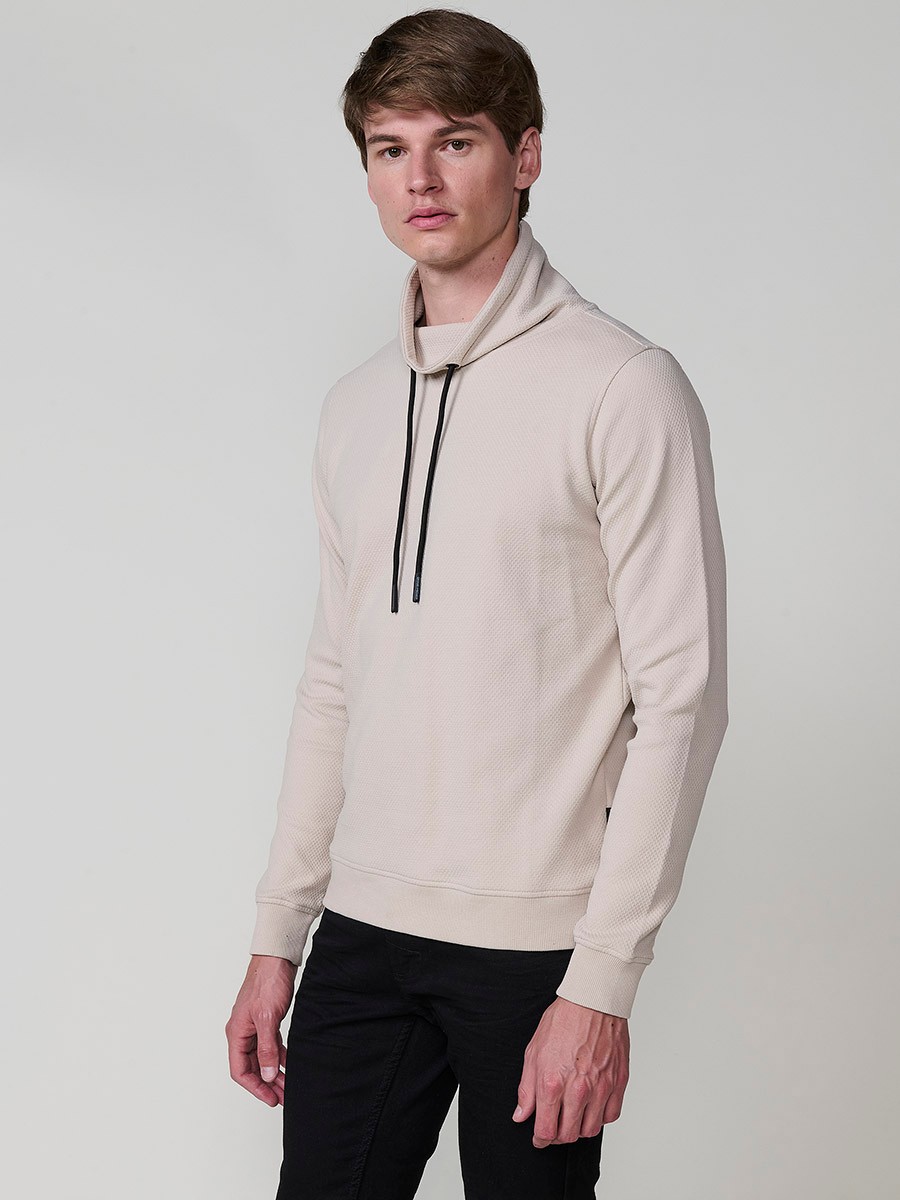 Men’s beige sweatshirt with long sleeves and high neck. Cotton and polyester blend for comfort and modern style.