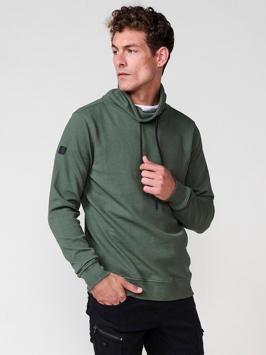 Sudadera kaki de hombre con cuello alto y manga larga. Algodón y poliéster para un estilo urbano, moderno y cómodo.