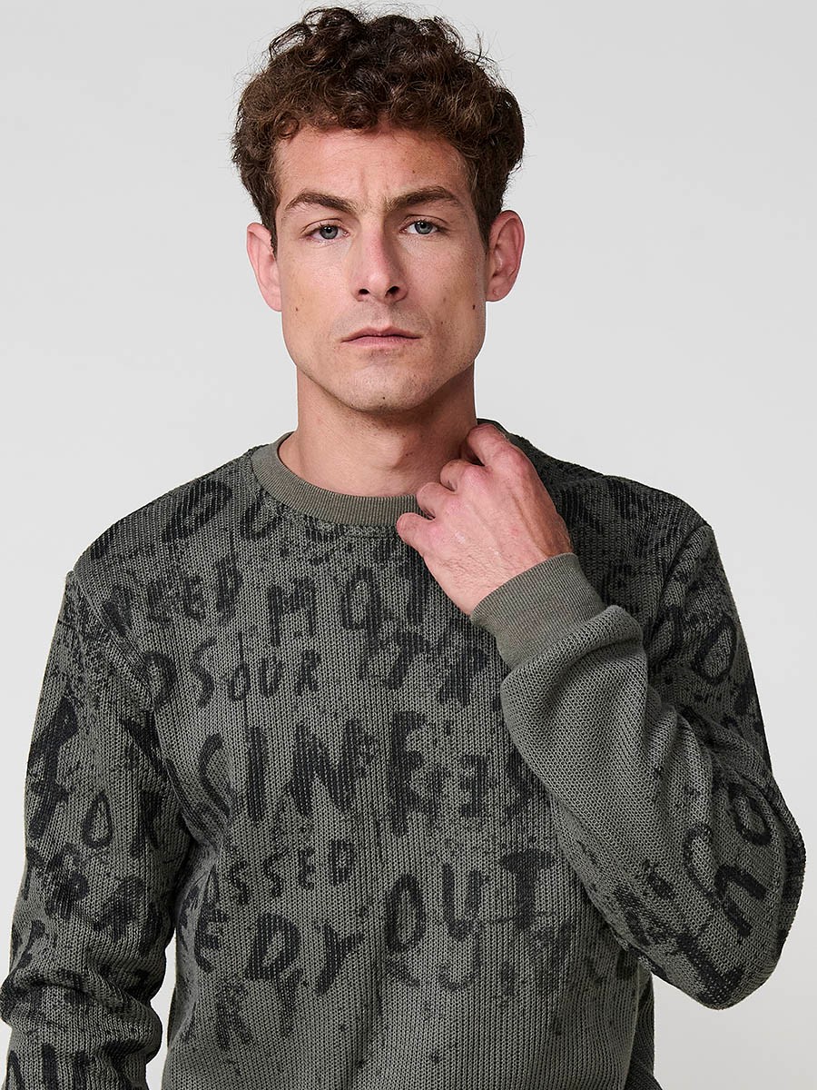 Sudadera kaki de hombre con cuello redondo. Exterior en tricot e interior suave para máxima comodidad y estilo urbano.