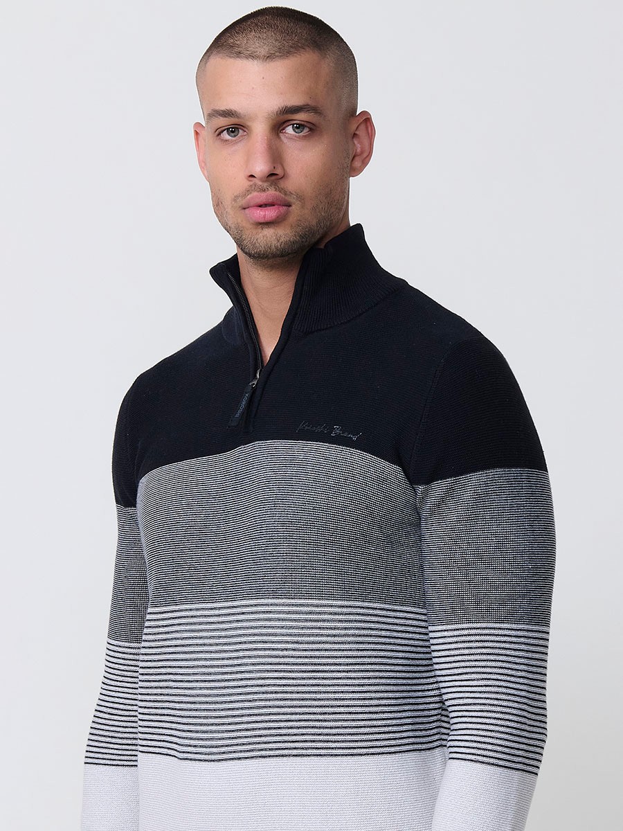 Jersey negro de hombre en tricot con cuello redondo y manga larga. Confección 100% acrílico para un estilo actual y versátil.