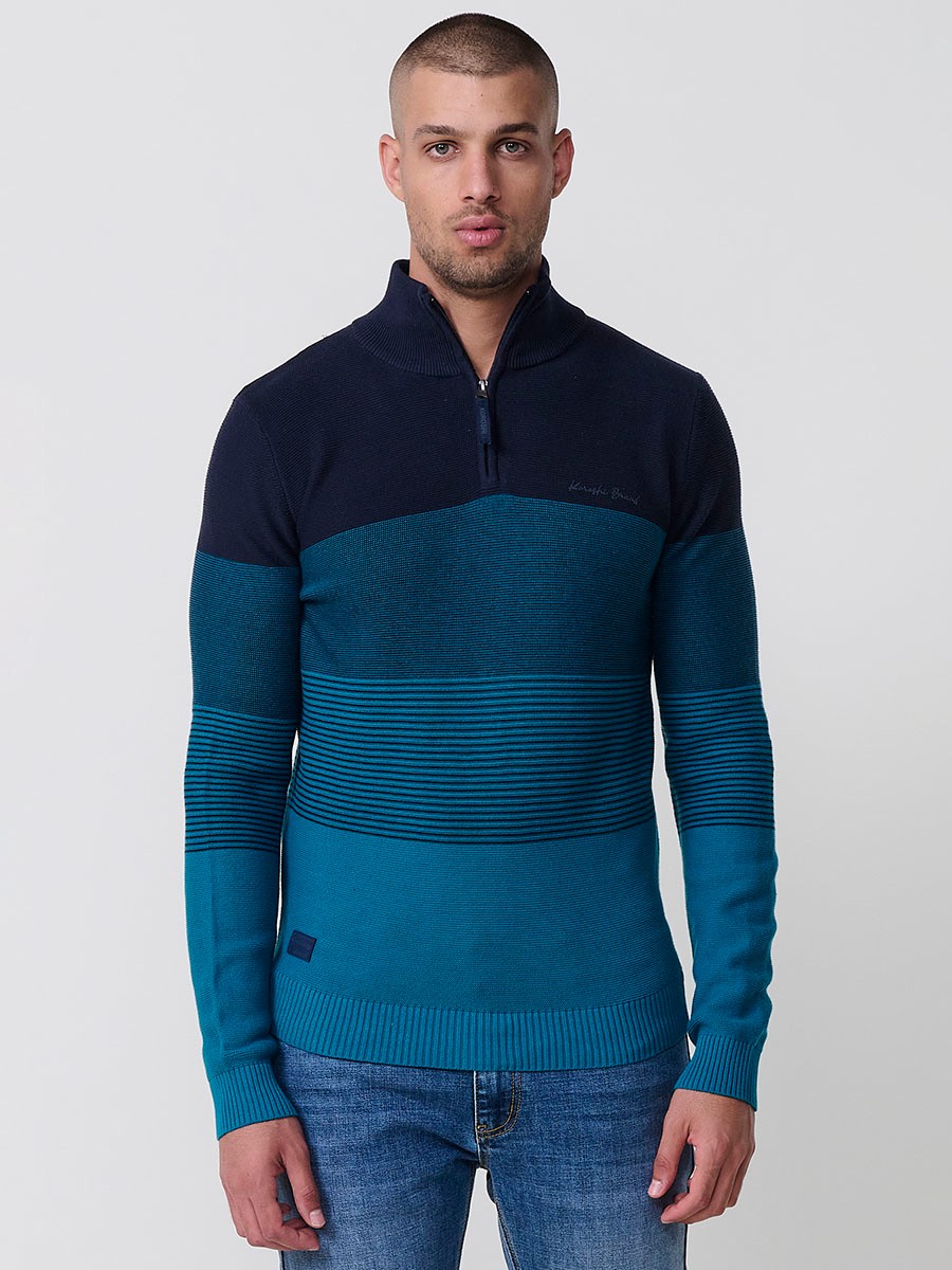 Jersey navy de hombre en tricot con cuello redondo y manga larga. Confección 100% acrílico para un estilo versátil y moderno.