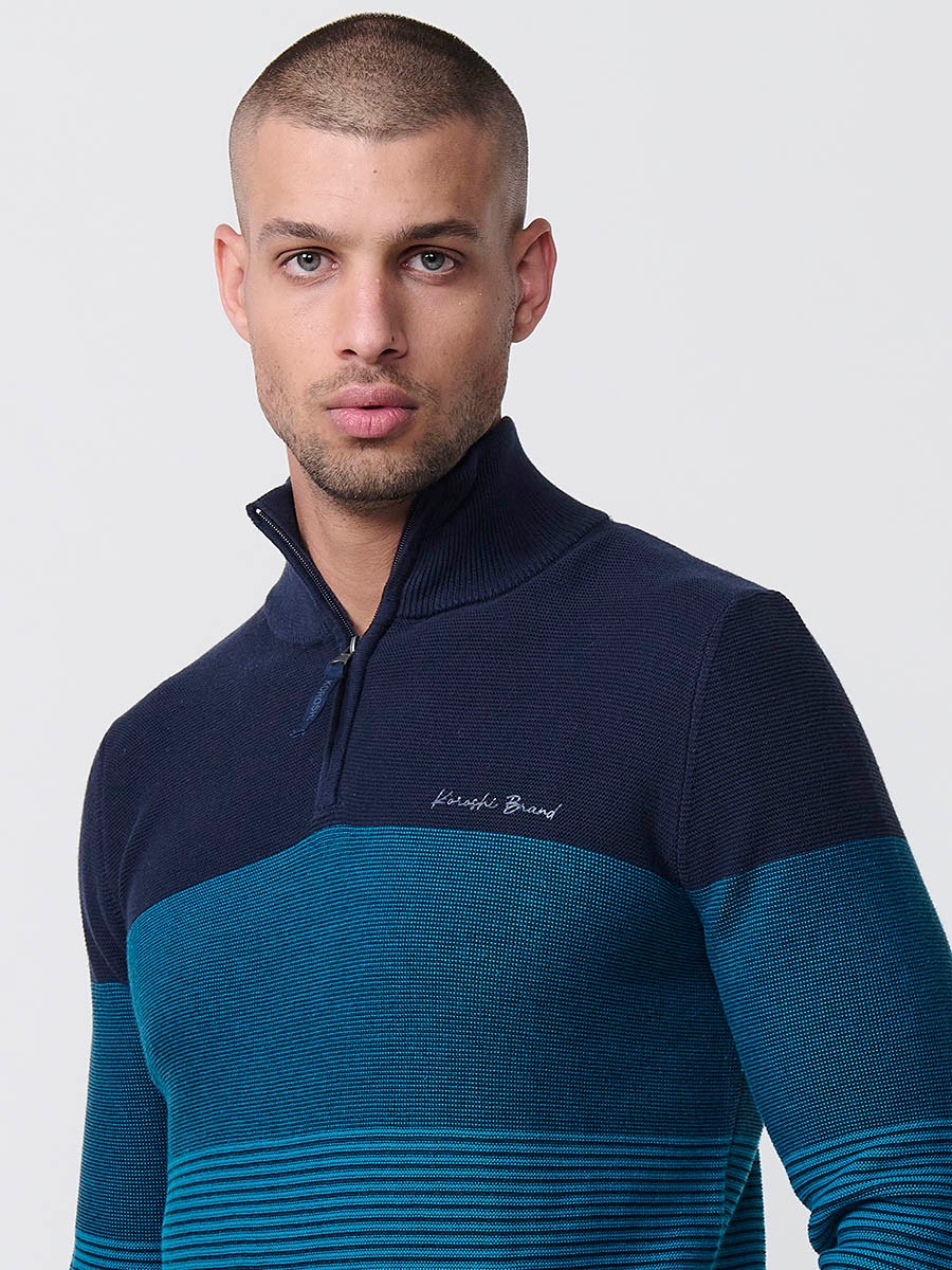 Jersey navy de hombre en tricot con cuello redondo y manga larga. Confección 100% acrílico para un estilo versátil y moderno.