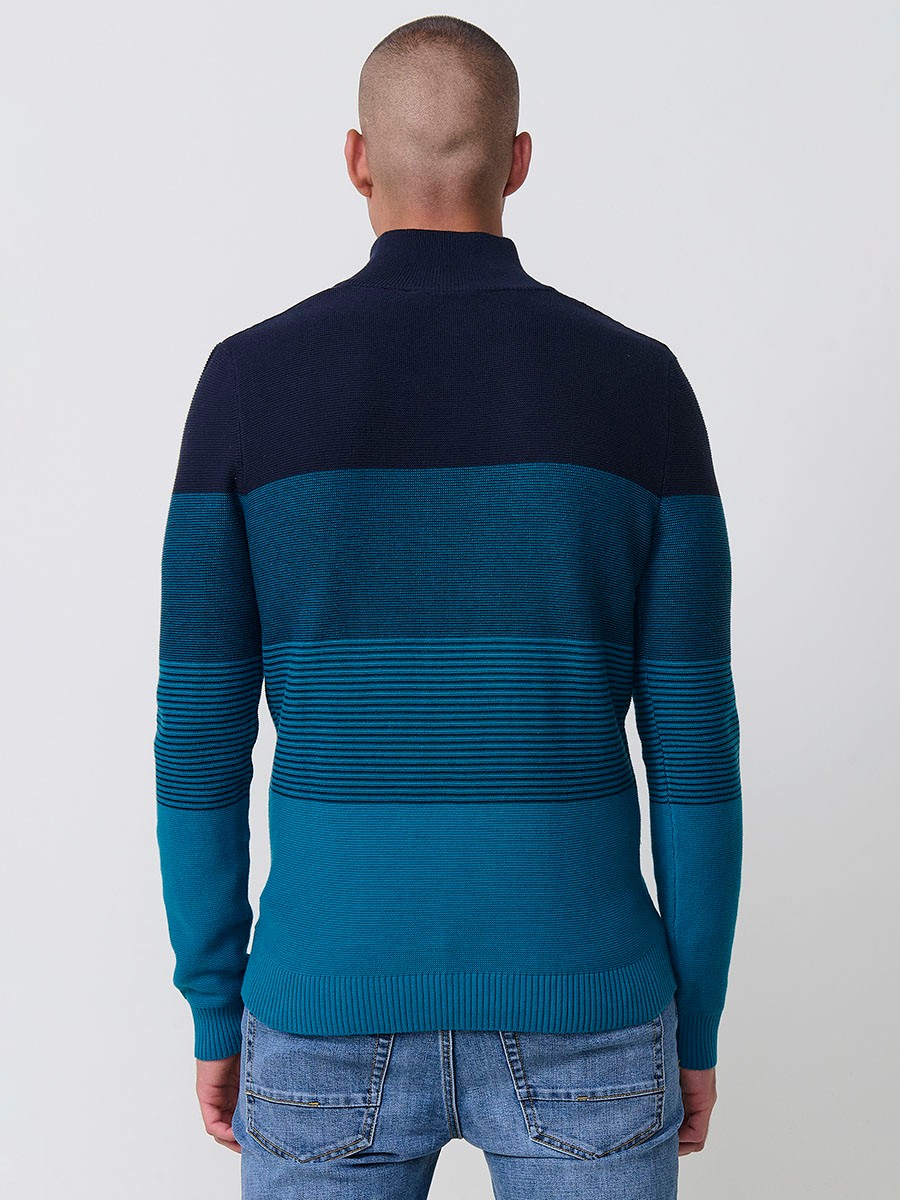 Jersey navy de hombre en tricot con cuello redondo y manga larga. Confección 100% acrílico para un estilo versátil y moderno.