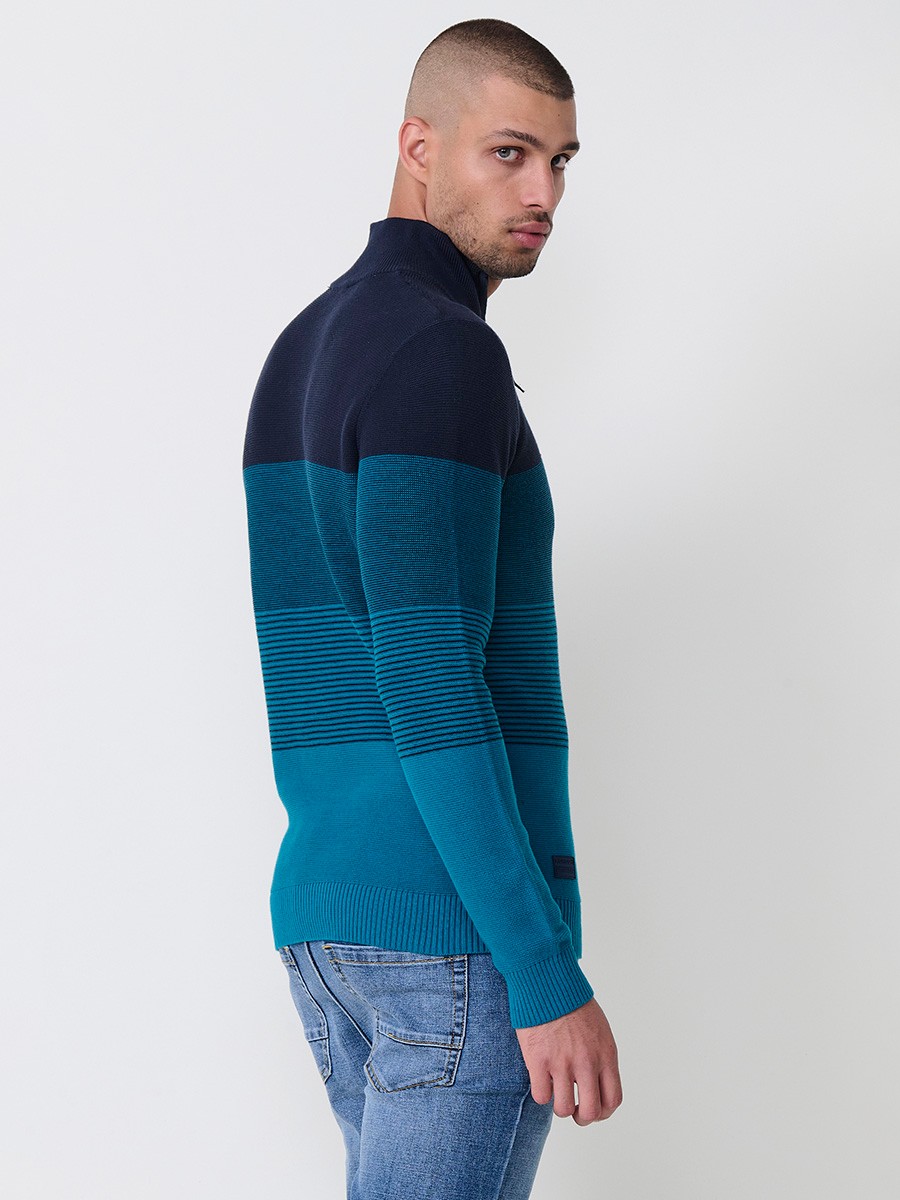 Jersey navy de hombre en tricot con cuello redondo y manga larga. Confección 100% acrílico para un estilo versátil y moderno.