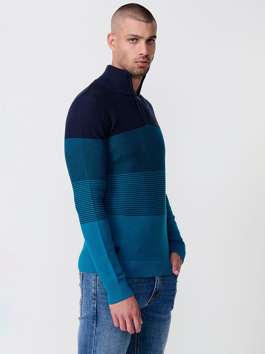 Jersey navy de hombre en tricot con cuello redondo y manga larga. Confección 100% acrílico para un estilo versátil y moderno.