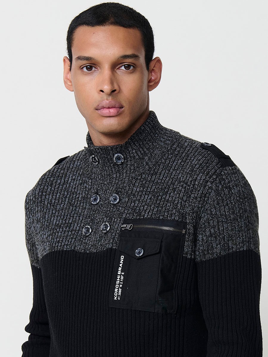 Jersey negro de hombre en tricot con cuello redondo y manga larga. Confección 100% acrílico para un estilo actual y versátil.