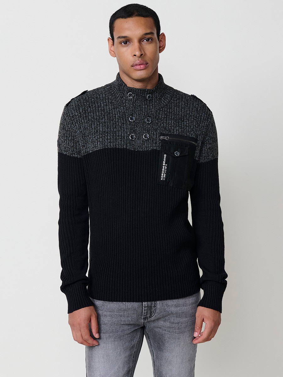 Jersey negro de hombre en tricot con cuello redondo y manga larga. Confección 100% acrílico para un estilo actual y versátil.