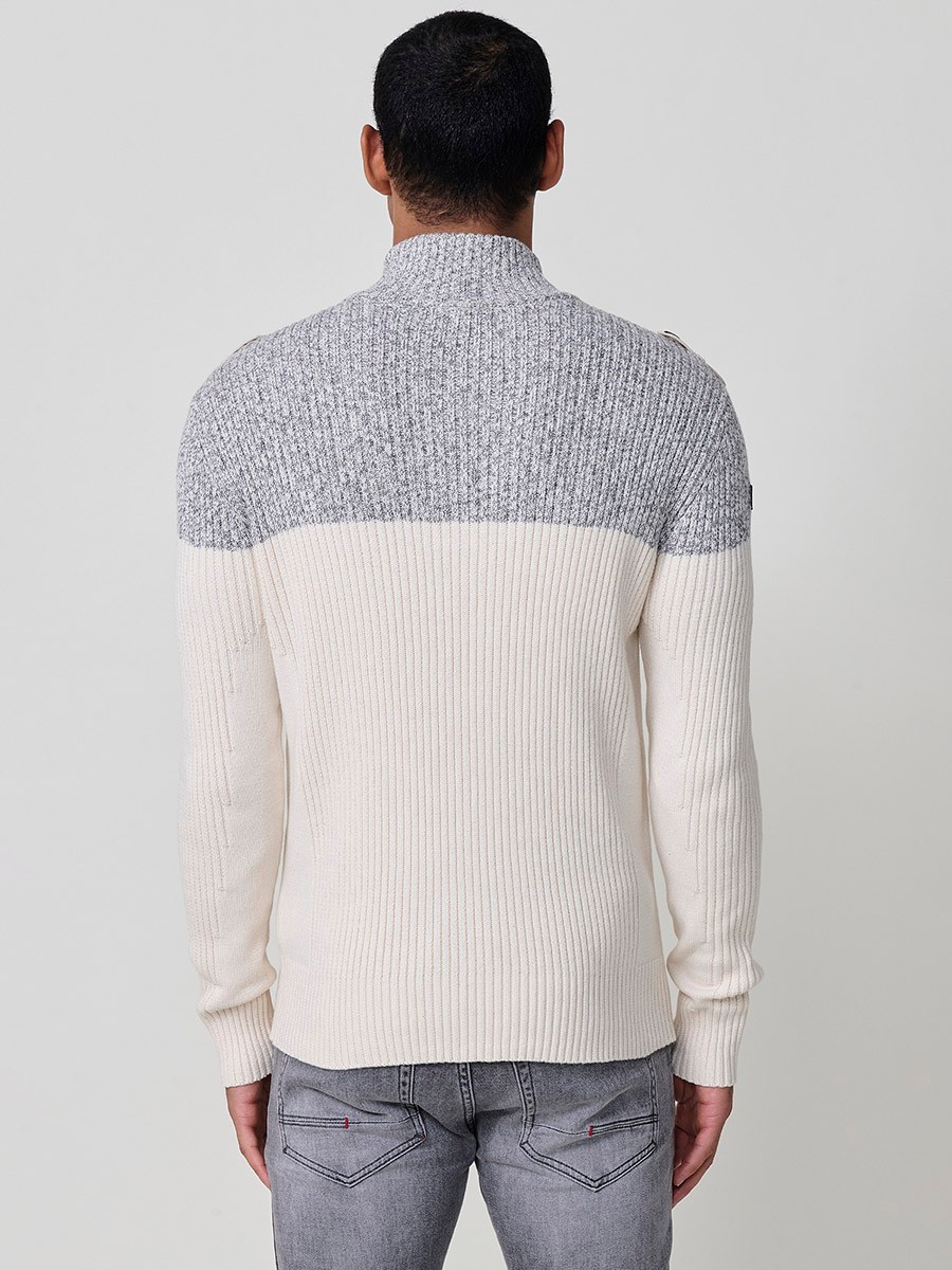 Jersey crudo de hombre en tricot con cuello redondo y manga larga. Confección 100% acrílico para un estilo versátil y cómodo.