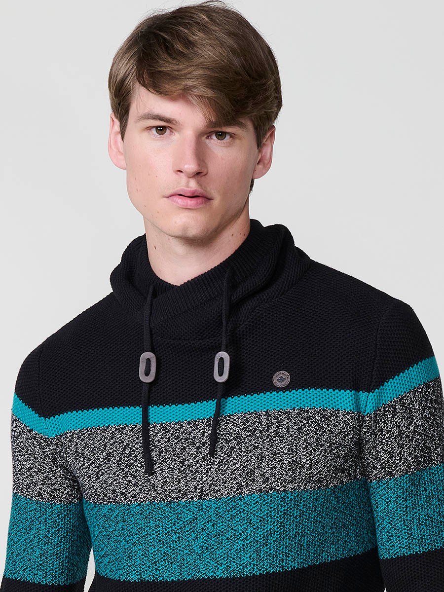 Jersey negro de hombre en tricot con cuello redondo y manga larga. Confección 100% acrílico para un estilo cómodo, moderno y versátil.