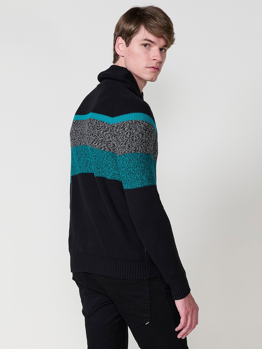 Jersey negro de hombre en tricot con cuello redondo y manga larga. Confección 100% acrílico para un estilo cómodo, moderno y versátil.