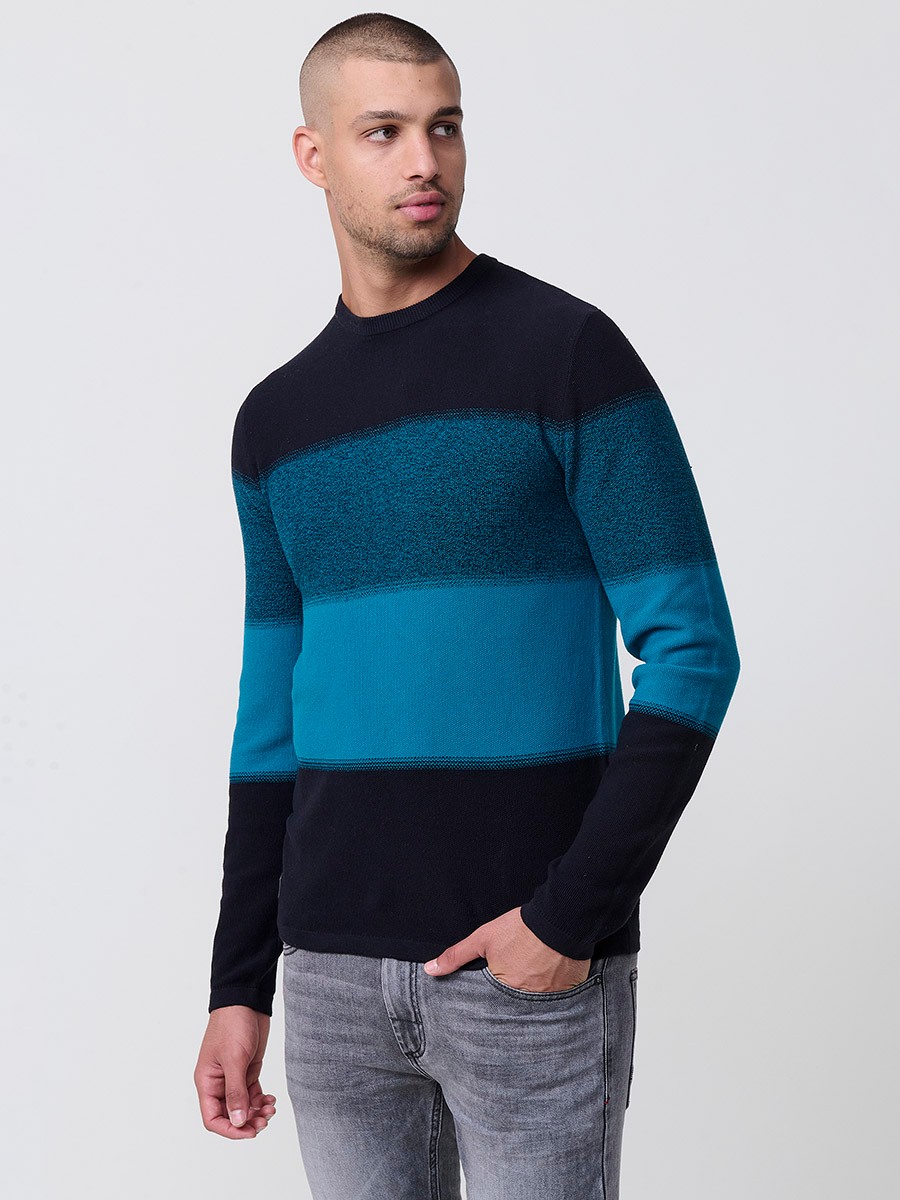 Jersey petróleo de hombre en tricot con cuello redondo y manga larga. Tejido 100% acrílico, ligero y versátil para todas las temporadas.