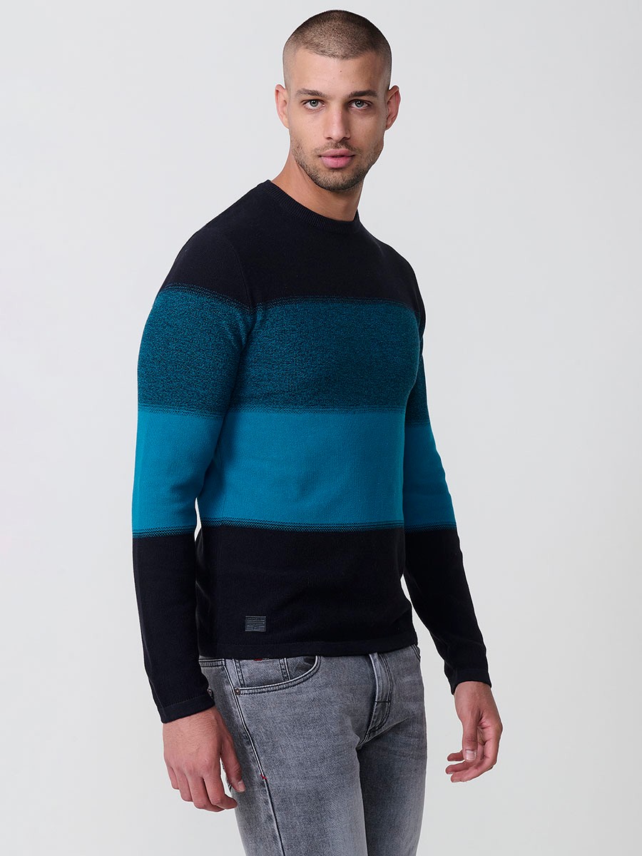 Jersey petróleo de hombre en tricot con cuello redondo y manga larga. Tejido 100% acrílico, ligero y versátil para todas las temporadas.