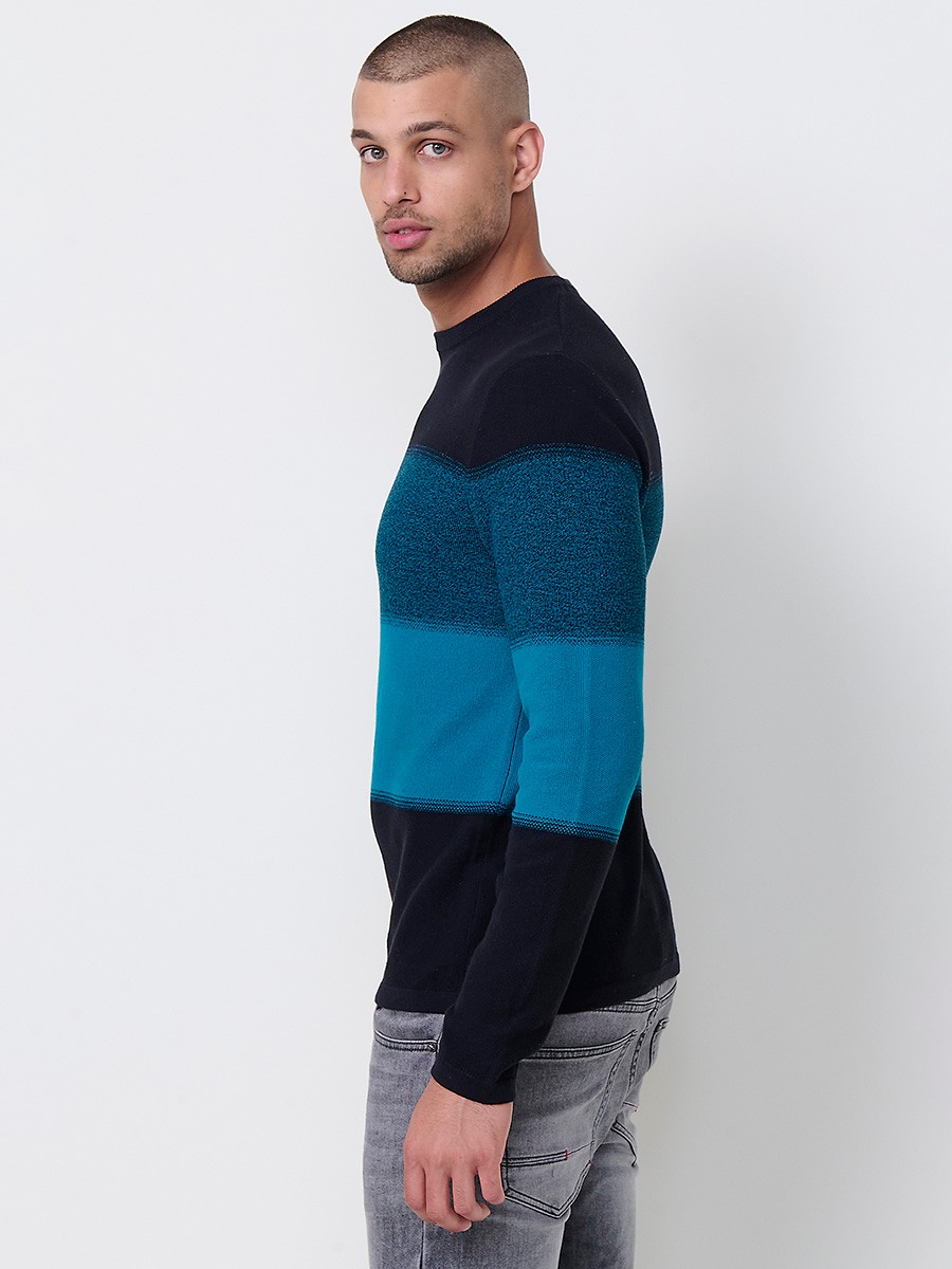 Jersey petróleo de hombre en tricot con cuello redondo y manga larga. Tejido 100% acrílico, ligero y versátil para todas las temporadas.