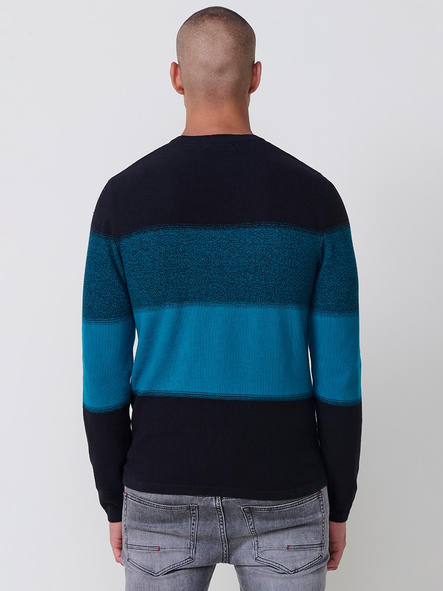 Jersey petróleo de hombre en tricot con cuello redondo y manga larga. Tejido 100% acrílico, ligero y versátil para todas las temporadas.